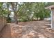 Expansive backyard with mature trees providing ample shade and privacy at 618 Meadow Park Dr, Minneola, FL 34715
