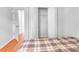 Bedroom showcasing hardwood floors and closet space at 618 Meadow Park Dr, Minneola, FL 34715