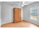 Bedroom featuring an armoire and laminate floors and lots of light at 618 Meadow Park Dr, Minneola, FL 34715