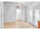 Dining area with tile flooring, a modern chandelier, and adjoining rooms at 618 Meadow Park Dr, Minneola, FL 34715