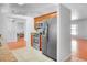 Features modern stainless steel appliances and spacious tile flooring adjoining breakfast nook at 618 Meadow Park Dr, Minneola, FL 34715
