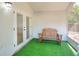 Relaxing porch with a wooden bench at 618 Meadow Park Dr, Minneola, FL 34715