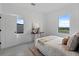 Serene bedroom with neutral tones, stylish furnishings, and ample natural light, creating a relaxing atmosphere at 6340 Chorus Dr, Mascotte, FL 34753