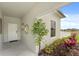 Inviting front porch with stylish decor, lush plants, and a modern design, creating a welcoming entrance at 6340 Chorus Dr, Mascotte, FL 34753
