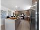 Modern kitchen with stainless steel appliances, center island, and open layout perfect for entertaining guests at 6340 Chorus Dr, Mascotte, FL 34753