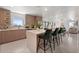 Bright open kitchen with counter seating, seamlessly connecting to the dining and living spaces at 6340 Chorus Dr, Mascotte, FL 34753