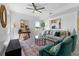 Stylish living room with plush seating, decorative rug, and ample natural light creating a cozy atmosphere at 6340 Chorus Dr, Mascotte, FL 34753