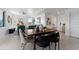 Bright and airy living space with modern decor, dining area, and ample natural light at 6340 Chorus Dr, Mascotte, FL 34753
