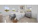 Bright bedroom with two windows, neutral decor, and a comfortable bed at 6427 Chorus Dr, Mascotte, FL 34753