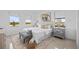 Bright bedroom with two windows, neutral decor, and a comfortable bed at 6427 Chorus Dr, Mascotte, FL 34753
