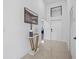 Hallway with high ceilings and a decorative table that adds elegance to the home's interior at 6427 Chorus Dr, Mascotte, FL 34753