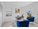 Bright home office with a wooden desk, stylish decor, and a view from the window at 6427 Chorus Dr, Mascotte, FL 34753