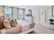 Spacious main bedroom with carpet, two windows and a white dresser in a calming and inviting space at 7054 Painted Bunting Way, St Cloud, FL 34773