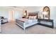 Comfortable bedroom with a well-appointed bed, stylish decor, and ample natural light at 7059 Painted Bunting Way, St Cloud, FL 34773