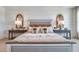 Cozy bedroom with stylish furniture, natural light, and neutral tones at 7059 Painted Bunting Way, St Cloud, FL 34773
