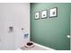 Functional laundry room with modern appliances and stylish decor at 7059 Painted Bunting Way, St Cloud, FL 34773