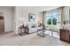 Comfortable living room features a sofa, side tables, modern decor, natural light and a TV for entertainment at 7059 Painted Bunting Way, St Cloud, FL 34773
