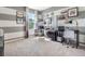 Bright office space with modern desks, shelving, and grey and white striped walls at 7059 Painted Bunting Way, St Cloud, FL 34773