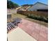 Wide shot of the backyard, featuring a patio set on a brick-laid patio and landscaping at 7228 Spring Villas Cir, Orlando, FL 32819