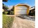 Lovely single-Gathering home featuring a spacious driveway and garage, framed by mature trees and verdant landscaping at 7228 Spring Villas Cir, Orlando, FL 32819