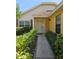 Welcoming front entrance with landscaped pathway, and a charming front door at 7228 Spring Villas Cir, Orlando, FL 32819