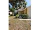 Welcoming front entrance featuring manicured shrubs and a quaint pathway to the front door at 7228 Spring Villas Cir, Orlando, FL 32819