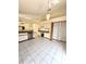 Well-lit kitchen features updated appliances, tile flooring, and lots of storage at 7228 Spring Villas Cir, Orlando, FL 32819