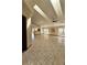 Spacious living room with tile flooring, ceiling fan, and abundant natural light from large windows at 7228 Spring Villas Cir, Orlando, FL 32819