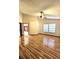 Spacious living room featuring wood flooring, a ceiling fan, and lots of natural light at 7228 Spring Villas Cir, Orlando, FL 32819