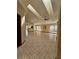 Spacious living room featuring tile floors, vaulted ceilings, and ample natural light from large windows at 7228 Spring Villas Cir, Orlando, FL 32819