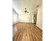 Open and airy main bedroom featuring hardwood floors, a ceiling fan, and an ensuite bathroom at 7228 Spring Villas Cir, Orlando, FL 32819