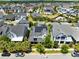 An aerial view of a home featuring solar panels in a community with palm trees at 7873 Dausset St, Orlando, FL 32827