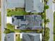 Aerial view of a well-maintained home featuring solar panels and landscaping in a suburban neighborhood at 7873 Dausset St, Orlando, FL 32827