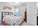 Neutrally decorated bedroom featuring patterned bedding and unique modern decorations at 7873 Dausset St, Orlando, FL 32827