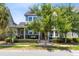 Charming two-story home with a cozy front porch, manicured landscaping, and beautiful curb appeal at 7873 Dausset St, Orlando, FL 32827