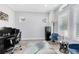 Bright home office featuring hardwood floors, multiple windows, and elegant furnishings at 7873 Dausset St, Orlando, FL 32827