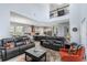 Spacious living room featuring an open layout, modern finishes, and seamless transition to the kitchen and dining areas at 7873 Dausset St, Orlando, FL 32827