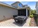 Rear covered patio with patio furniture, grill and covered pool table at 7873 Dausset St, Orlando, FL 32827