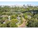 Stunning aerial view of the neighborhood, showcasing its lush greenery, lake and proximity to downtown Orlando at 100 Kennison Dr, Orlando, FL 32801