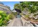 Charming backyard garden area featuring raised beds and a shaded seating area at 100 Kennison Dr, Orlando, FL 32801
