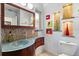 Elegant bathroom featuring a unique vanity, decorative tiles, and modern lighting at 100 Kennison Dr, Orlando, FL 32801