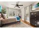 Serene bedroom featuring a comfortable bed, modern furnishings, and plenty of natural light at 100 Kennison Dr, Orlando, FL 32801