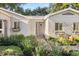 Charming home with a well-maintained front yard featuring lush landscaping and a welcoming entrance at 100 Kennison Dr, Orlando, FL 32801