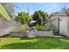 Backyard garden featuring raised flower beds and lush green grass, for outdoor enjoyment at 100 Kennison Dr, Orlando, FL 32801