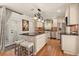 Modern kitchen with a large island, stainless steel appliances, and custom cabinetry for ample storage at 100 Kennison Dr, Orlando, FL 32801