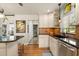 Well-appointed kitchen featuring granite countertops, a stylish backsplash, and stainless steel appliances at 100 Kennison Dr, Orlando, FL 32801