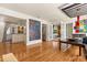 Bright living room featuring hardwood floors, contemporary artwork, and direct access to the gourmet kitchen at 100 Kennison Dr, Orlando, FL 32801