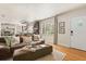 A stylish living room featuring hardwood floors, a modern sofa with accent pillows, and an open floor plan at 100 Kennison Dr, Orlando, FL 32801