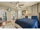Spacious main bedroom provides backyard access and a glimpse into the ensuite bathroom and walk-in closet at 100 Kennison Dr, Orlando, FL 32801