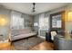 Cozy home office with natural light, a comfortable sofa, and an organized workspace at 100 Kennison Dr, Orlando, FL 32801